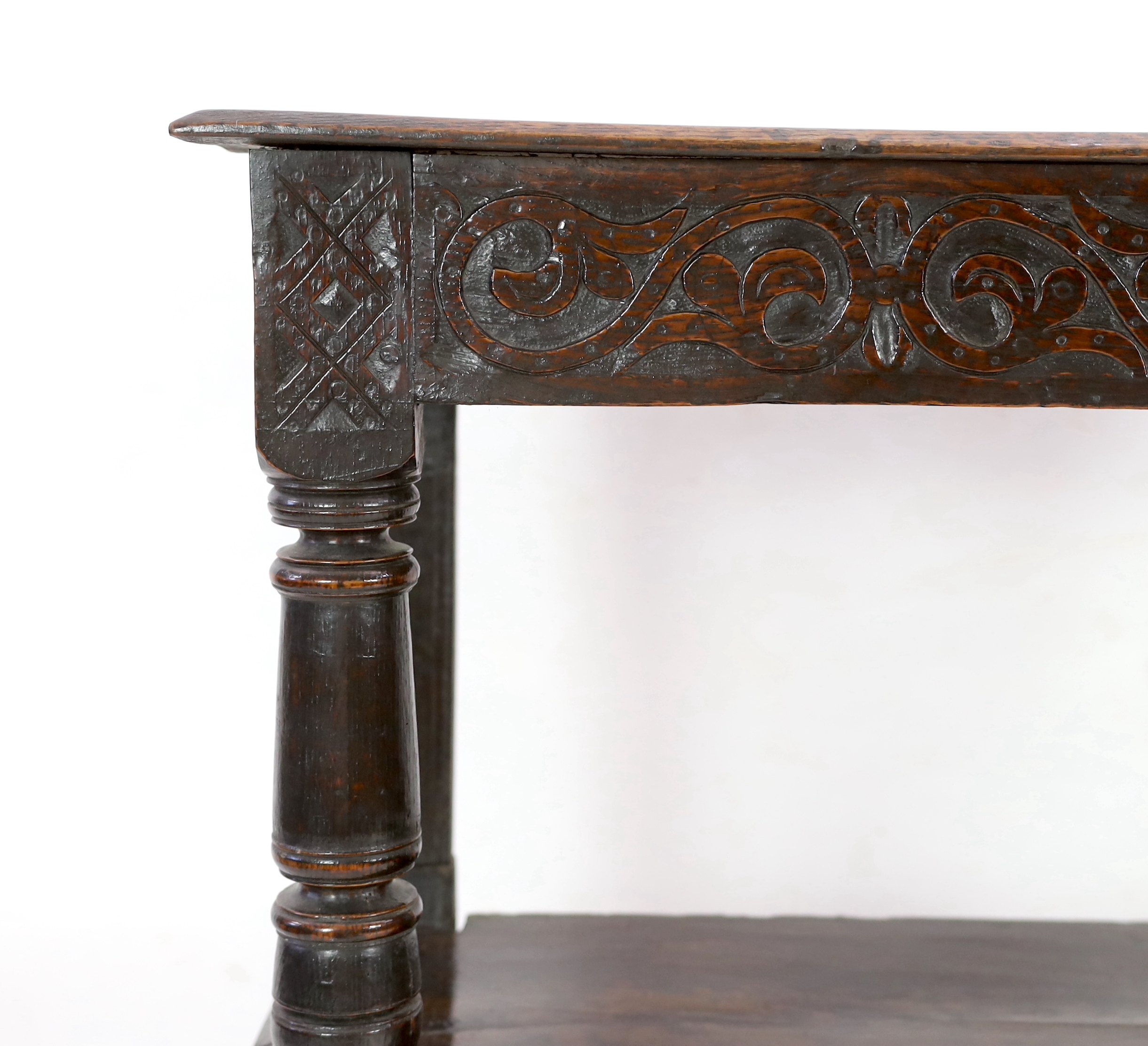 An early 17th century oak three tier buffet